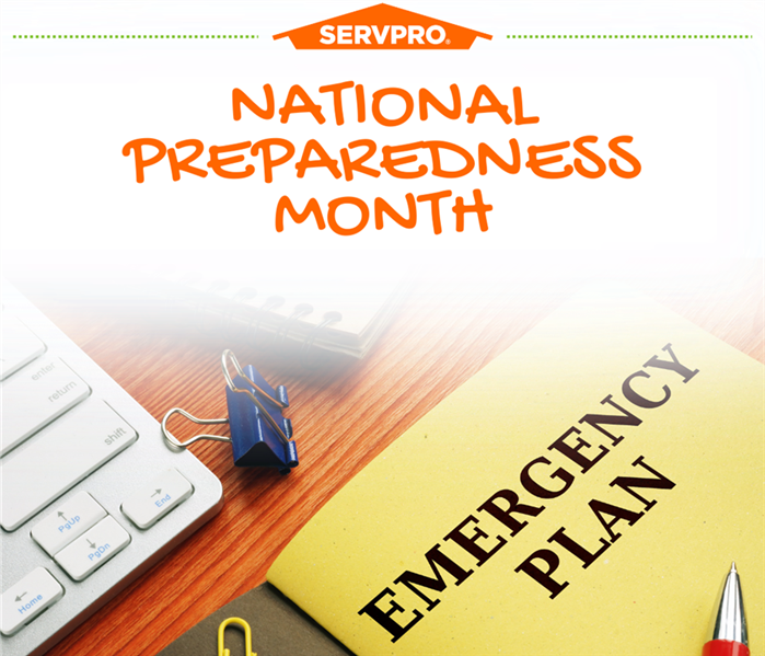 Emergency plan notebook with office supplies and heading National Prepareness Month and SERVPRO Logo